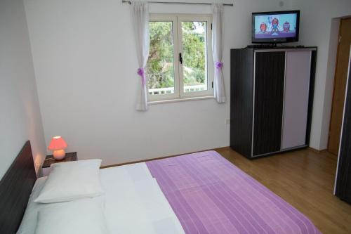Un pat sau paturi într-o cameră la Villa Magnolija