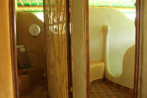an open door to a bathroom with a toilet at Sol de Minca Eco Lodge in Minca