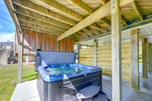 a hot tub on the back of a house at Oceanfront Emerald Isle Escape with Private Hot Tub! in Emerald Isle