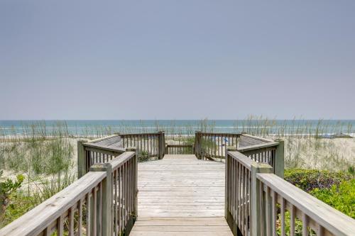a wooden boardwalk leading to the beach at Oceanfront Emerald Isle Escape with Private Hot Tub! in Emerald Isle
