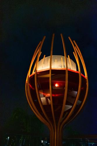 a street light with a building in the background at Playa Palmera Beach Resort in Punta Cana