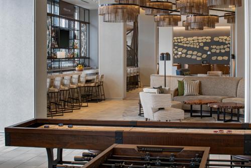 a lobby with a ping pong table and a bar at Hyatt Regency Portland at the Oregon Convention Center in Portland