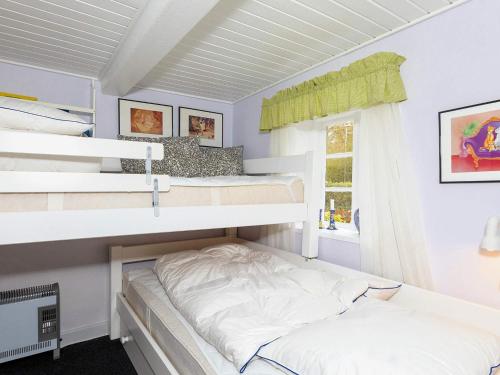 Postel nebo postele na pokoji v ubytování 4 person holiday home in Nykøbing M-By Traum