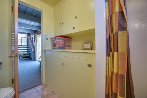a kitchen with yellow cabinets and a toilet at Fishing Paradise on 160 Acres about 13 Mi to Saratoga in Saratoga