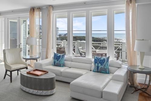a living room with a white couch and a table at BEAUTIFUL GULF VIEWS Spacious, Updated 316B WaterSound Crossings Steps to Beach and Pool condo in Panama City Beach