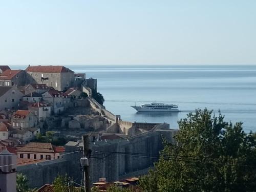 a cruise ship on the water near a city at Seaview Dubrovnik Old Town in Dubrovnik