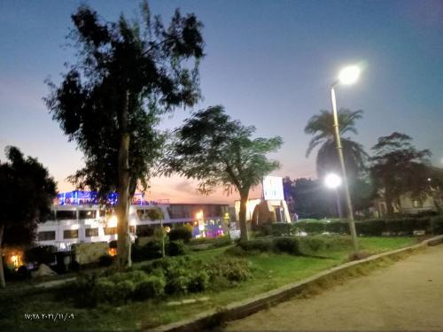 a bus parked next to a street light at night at مركب ريفر River Boat in Cairo