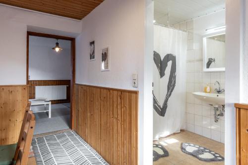 a bathroom with a toilet and a sink at Zur Kleinen Hummel in Gernrode - Harz