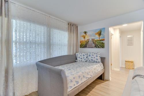 a bedroom with a bed and a large window at Largo House with Backyard Oasis and Proximity to Beach in Largo