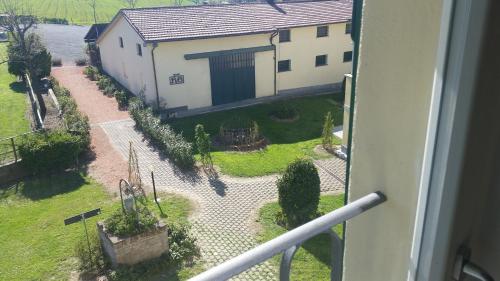 a view from a balcony of a house and a yard at Casa Selene Rocchi in Savignano sul Panaro