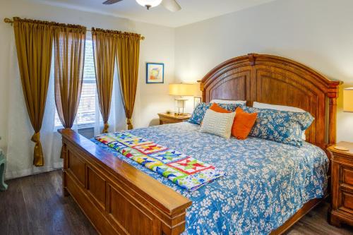 a bedroom with a large bed with a wooden headboard at Game Room and Walk to Beach Gun Barrel City Gem! in Gun Barrel City