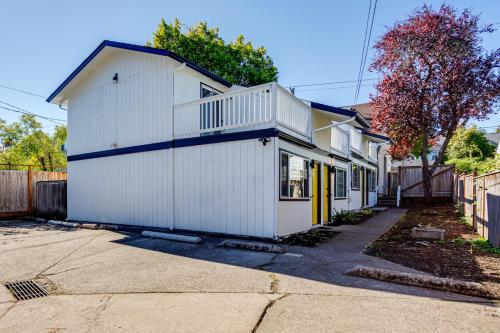 a white house with a blue roof at Retreat near UO, Autzen Stadium, Amazon Park (# 1) in Eugene