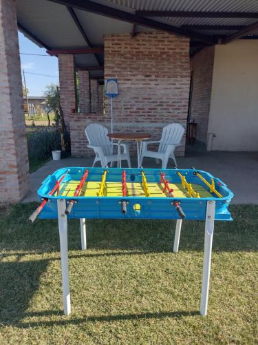 a table with a bunch of baseball bats on it at Casa de campo Los Cardenales in Rafaela