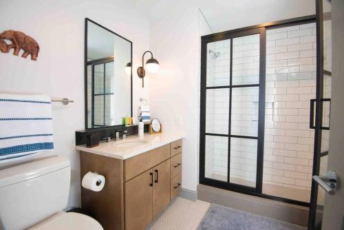 a bathroom with a sink and a mirror at Lovely Condo in Downtown Birmingham in Birmingham