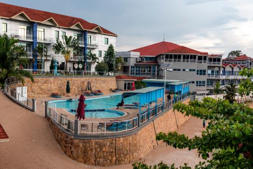 a swimming pool in front of a resort at Dove Hotel Kigali in Kigali