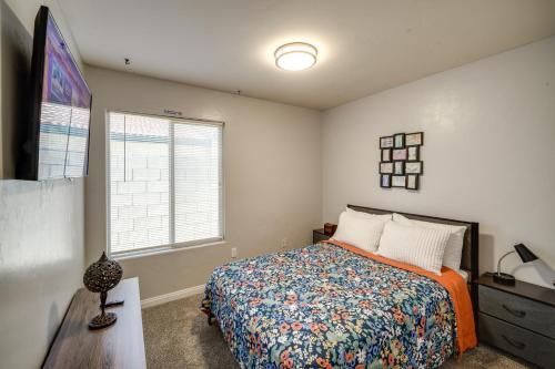 a bedroom with a bed and a dresser and a window at Private Pool and Patio Pet-Friendly Bakersfield Gem in Bakersfield