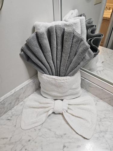 a pile of towels on a counter in a bathroom at Relaxing Oasis with Pool Gazebo in Family-Friendly Neighborhood in Montgomery