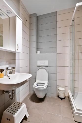 a bathroom with a toilet and a sink at Belvedere Bjelasnica in Bjelašnica