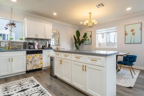 a kitchen with white cabinets and a counter top at Angel & Rose * Hollywood DTLA in Los Angeles