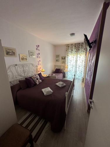 a bedroom with a large bed in a room at B&B San Vitale in Bologna