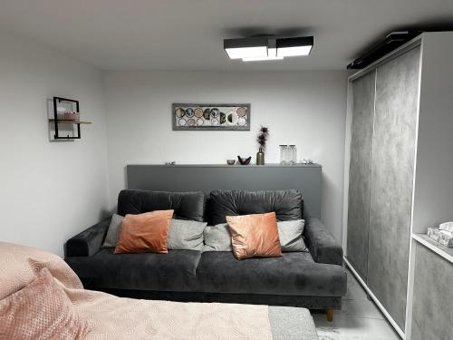 a living room with a couch with pillows on it at Villa Sirenis in Trogir