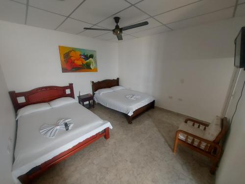 Postel nebo postele na pokoji v ubytování Hotel Campestre Diamante Real