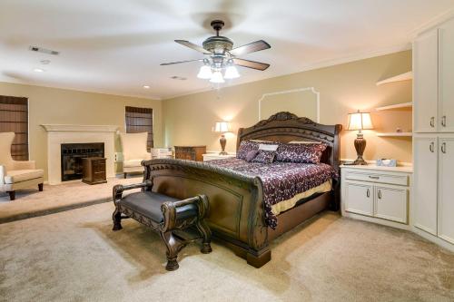a bedroom with a large bed and a ceiling fan at Expansive Texas City Retreat about 16 Mi to Galveston! in Texas City