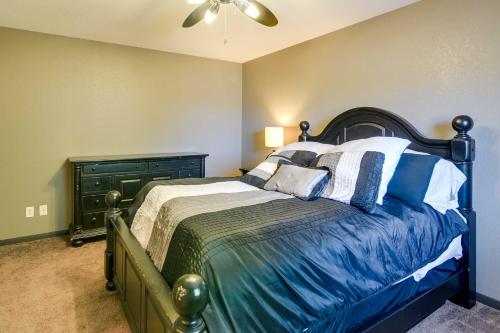 a bedroom with a bed with blue and white pillows at Expansive Texas City Retreat about 16 Mi to Galveston! in Texas City