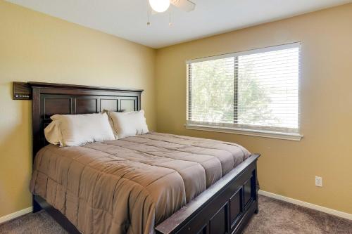 a bedroom with a large bed with a window at Expansive Texas City Retreat about 16 Mi to Galveston! in Texas City