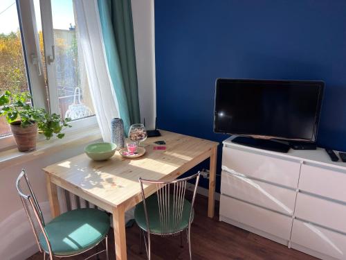 Телевизор и/или развлекательный центр в Apartament Parkowa Centrum