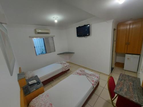 Uma cama ou camas num quarto em Hotel Mooca