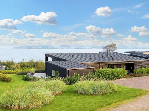 a house with a solarium on top of it at 8 person holiday home in L gstrup in Løgstrup