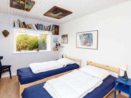 Postel nebo postele na pokoji v ubytování Holiday home Thyholm IX
