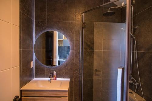 a bathroom with a sink and a mirror at Skyrim Lodge in Lake Tekapo