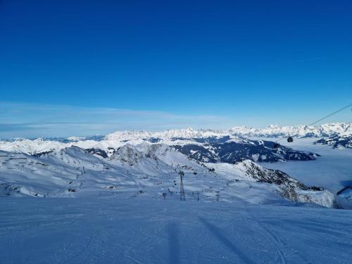 a snow covered mountain with a ski lift at Kitzbüheler Alpen XL in Bramberg am Wildkogel