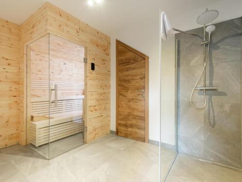 a bathroom with a shower and a glass shower stall at Aquarius Haus 9 TOP 18 in Sankt Lorenzen ob Murau