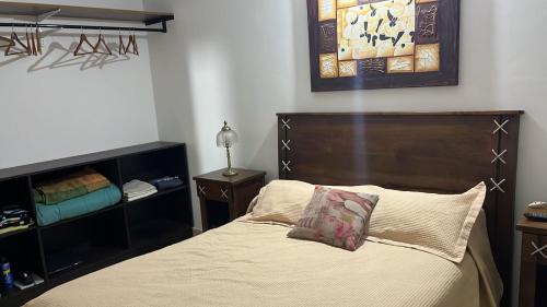 Una cama o camas en una habitación de Cambacuá Villa Rumipal