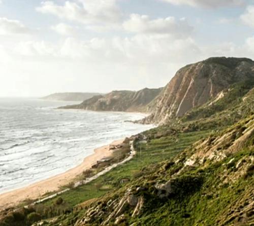 a view of the ocean and a sandy beach at La Foggia seaside paradise in Siculiana