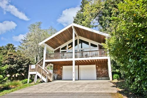 a house with a balcony and a garage at Captain's Hideaway in Nehalem