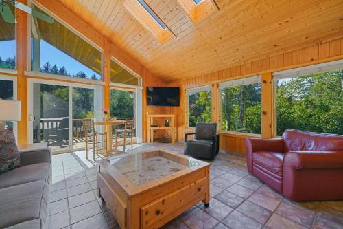 a living room with a couch and a coffee table at Captain's Hideaway in Nehalem