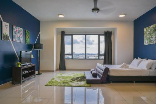a bedroom with a large bed and a window at Damen Subang by Widebed in Subang Jaya