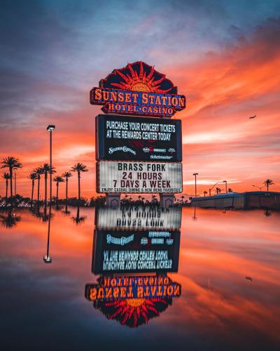 a sign in the water with a sunset in the background at Sunset Station Hotel & Casino in Las Vegas
