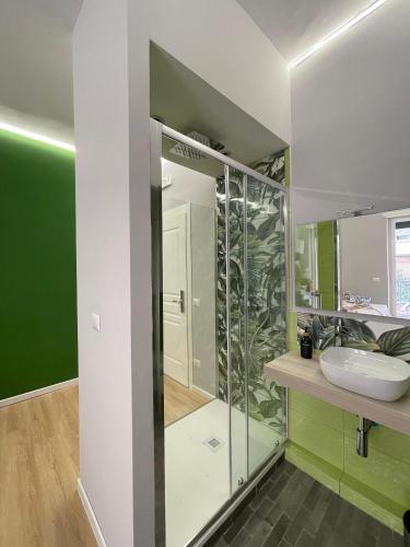 a bathroom with a sink and a mirror at Vomero Suite and Deluxe Room B&B Napoli in Naples