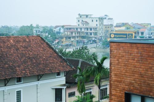 a view of a city with buildings and a river at AnAn Homestay Huế in Hue