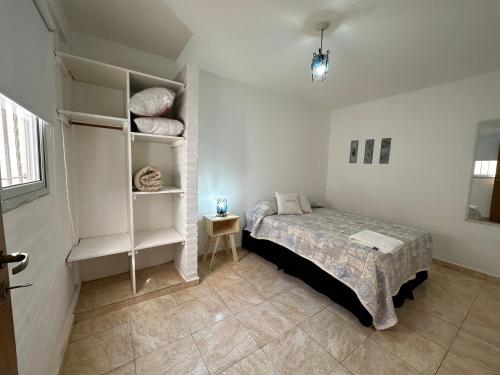 Ένα ή περισσότερα κρεβάτια σε δωμάτιο στο CONFORTABLE Dpto. Pasaje Tucumán