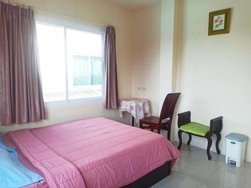 מיטה או מיטות בחדר ב-Nu Phuket Airport Resident 1