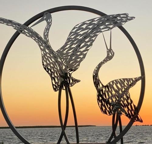 two metal sculptures of birds in a hoop at Gone Fishin Holiday Units in Karumba