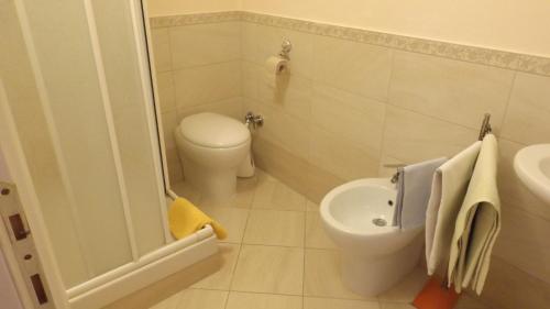 a small bathroom with a toilet and a sink at AFFITTACAMERE La Tartaruga in Civitanova Marche