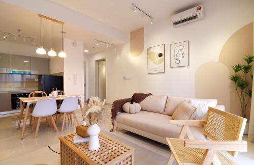a living room with a couch and a table at 10 min to My town family unit By Nexx Field in Kuala Lumpur