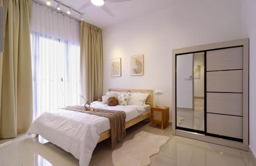 a bedroom with a bed and a large window at 10 min to My town family unit By Nexx Field in Kuala Lumpur
